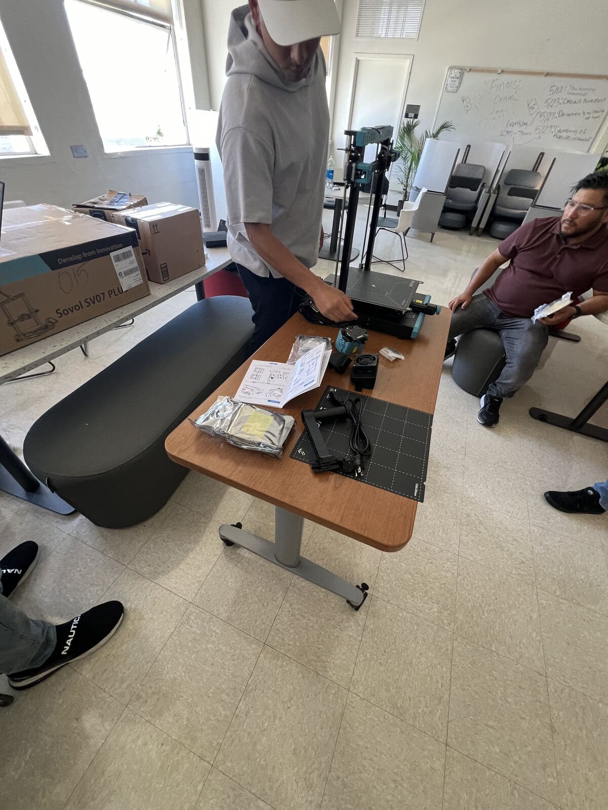 Members unboxing and assembling a Sovol 3D printer