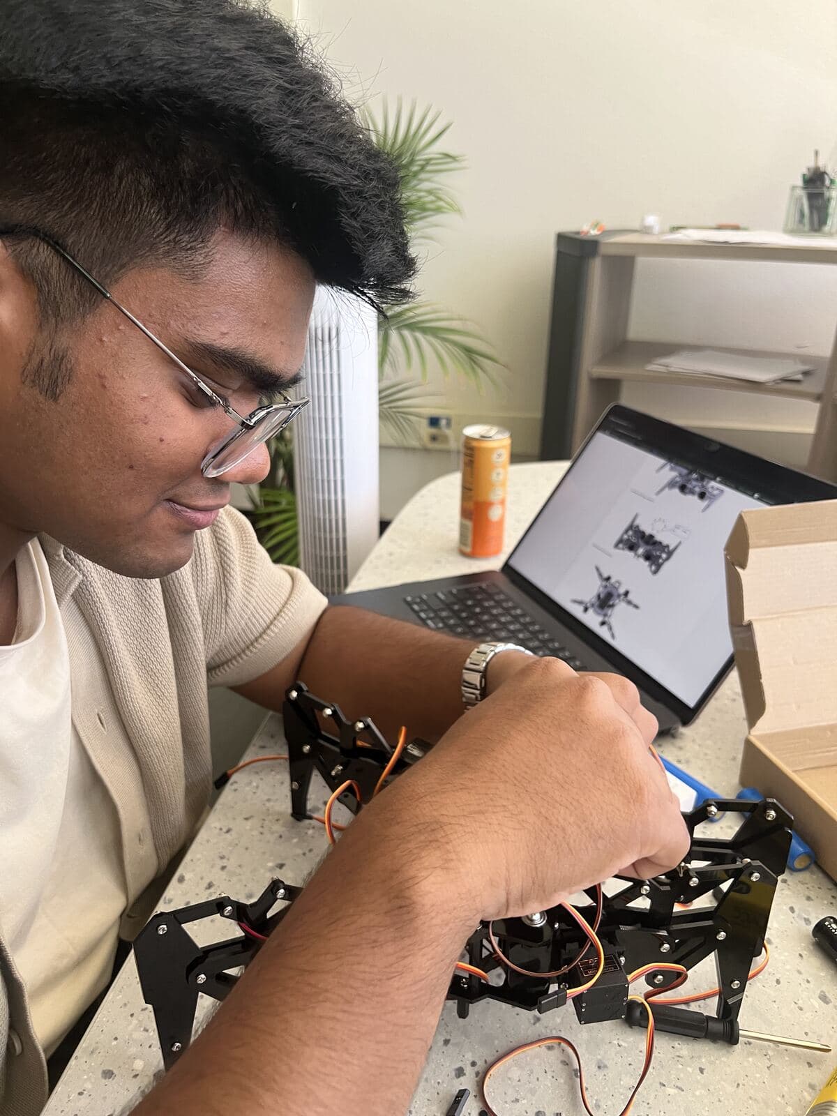 Member wiring servos on a multi-legged robot frame