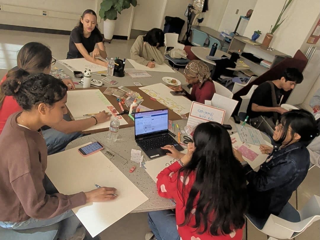 SHPEtinas members working on the vision board